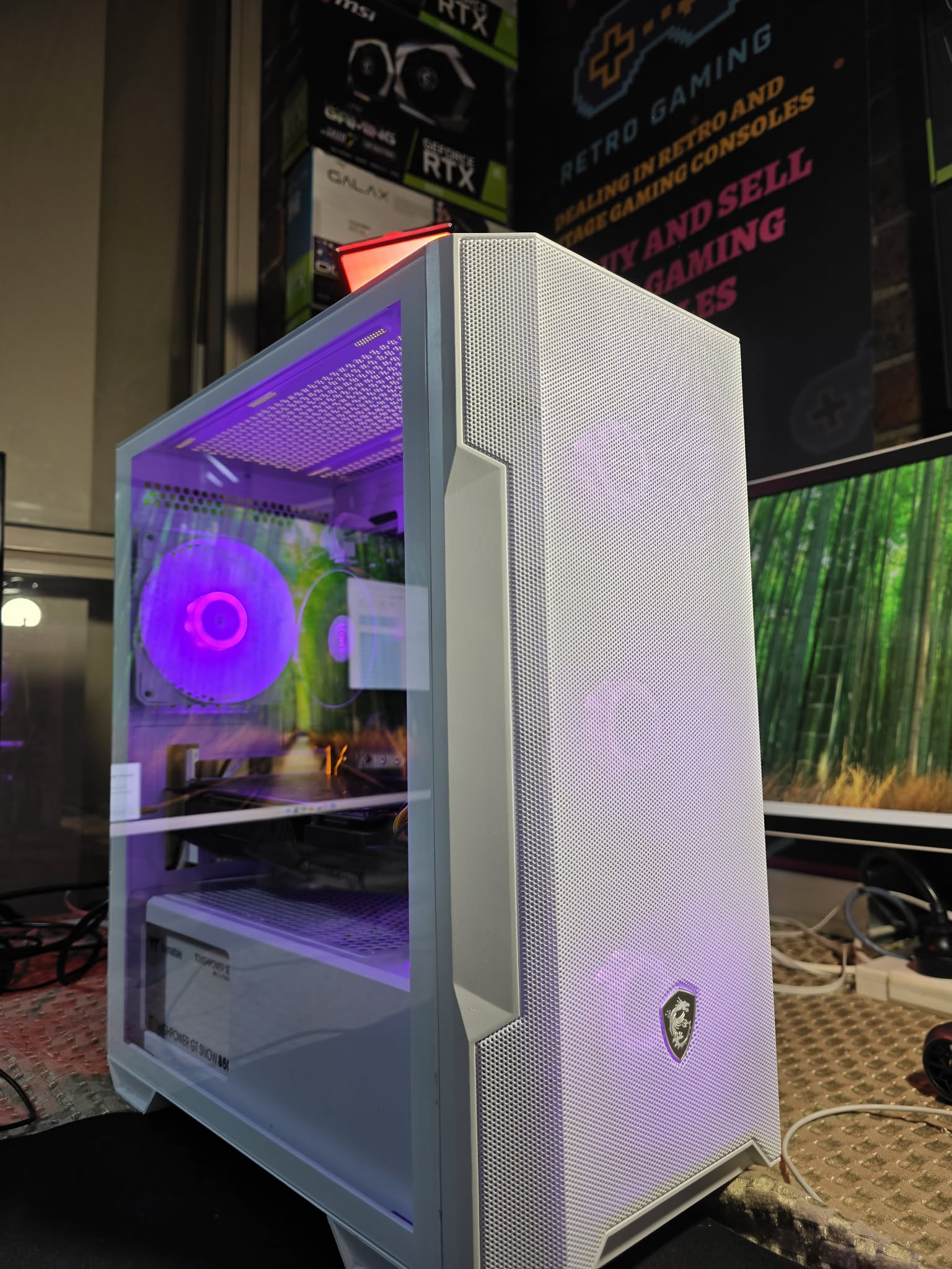 A white FixItUp PC build with colourful lighting